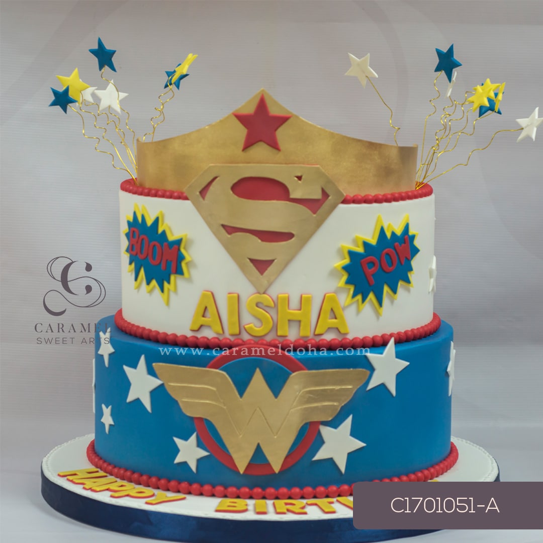 c171051-a.jpg Superwoman & Wonderwoman Themed Cake - Image 1